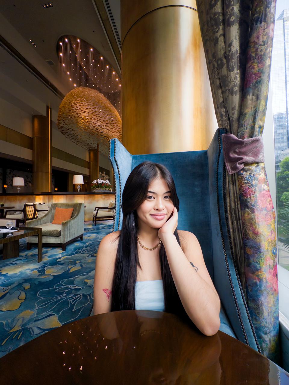 Sienna smiling by the window at Shangri-La The Fort Lounge in Bonifacio Global City