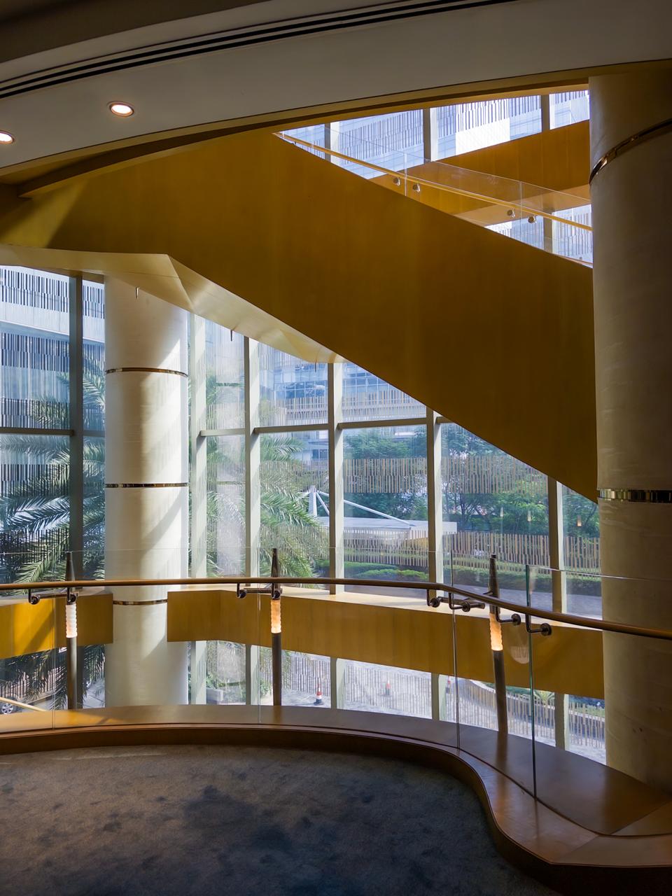 Golden staircase with window view at Shangri-La The Fort