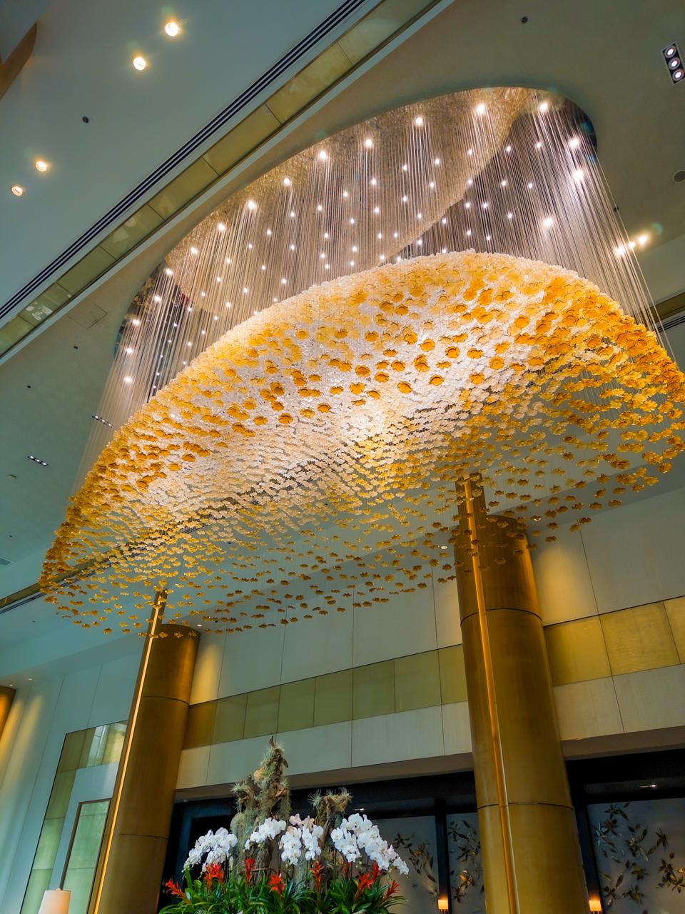 Golden chandelier hanging inside the High Street Lounge at Shangri-La The Fort Manila