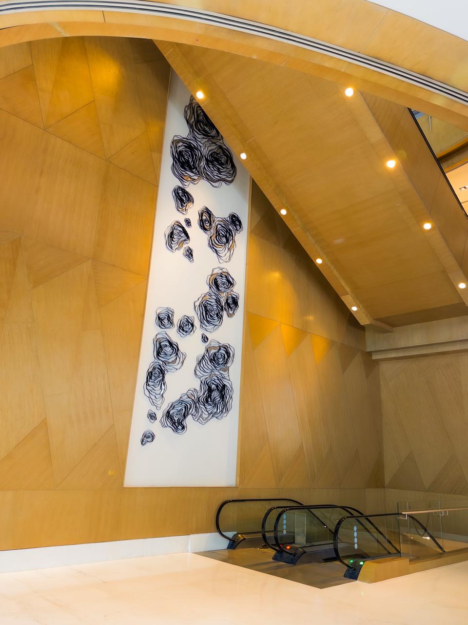 Decorative wall art panel with floral sculpture inside Shangri-La The Fort Manila lobby